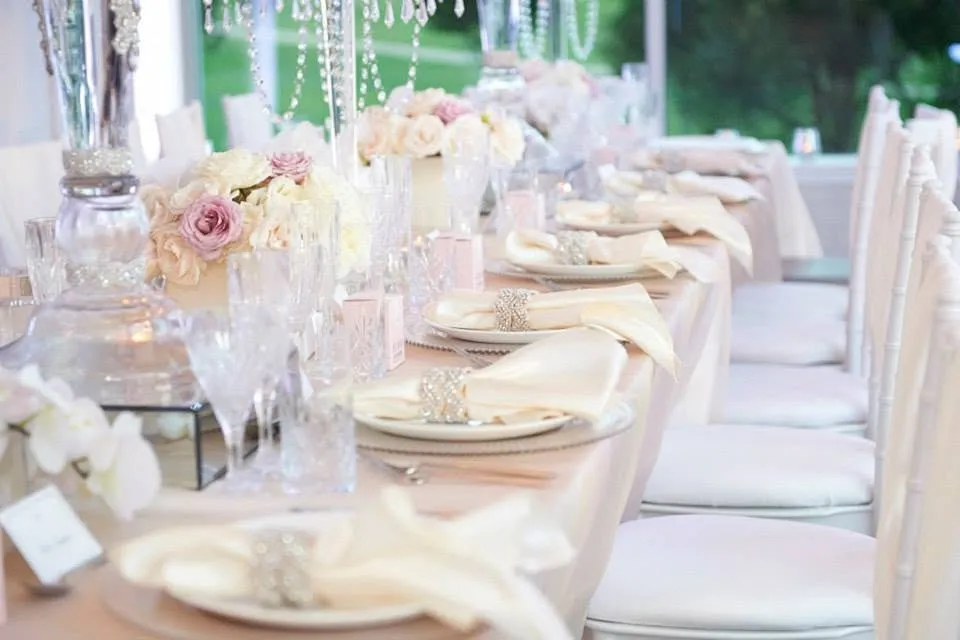A wedding table set with florals and fine place settings