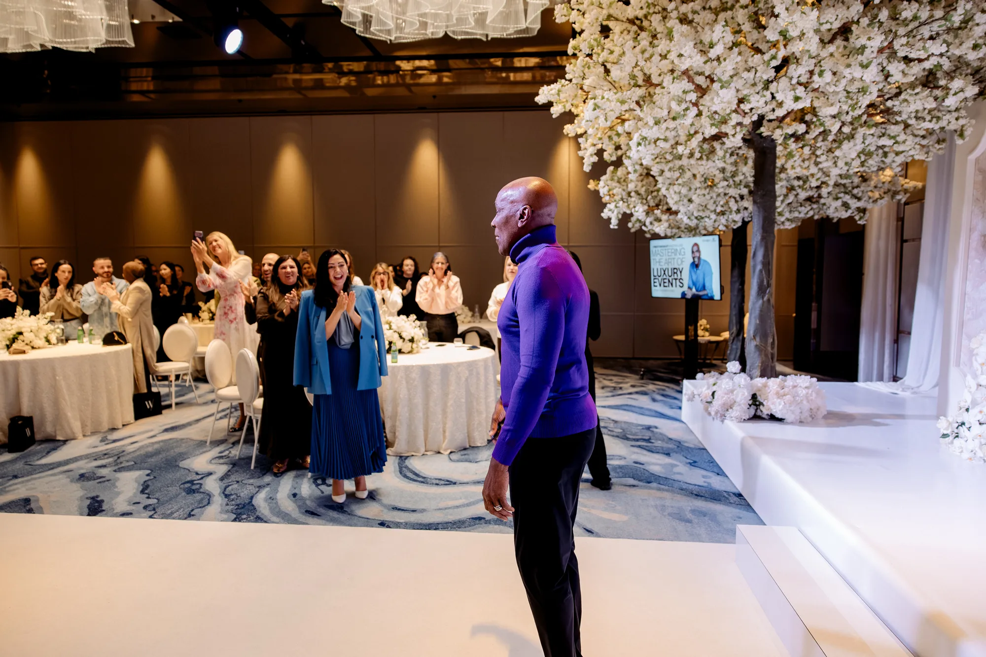 Delegates applauding a speaker at the Wedded Wonderland Summit