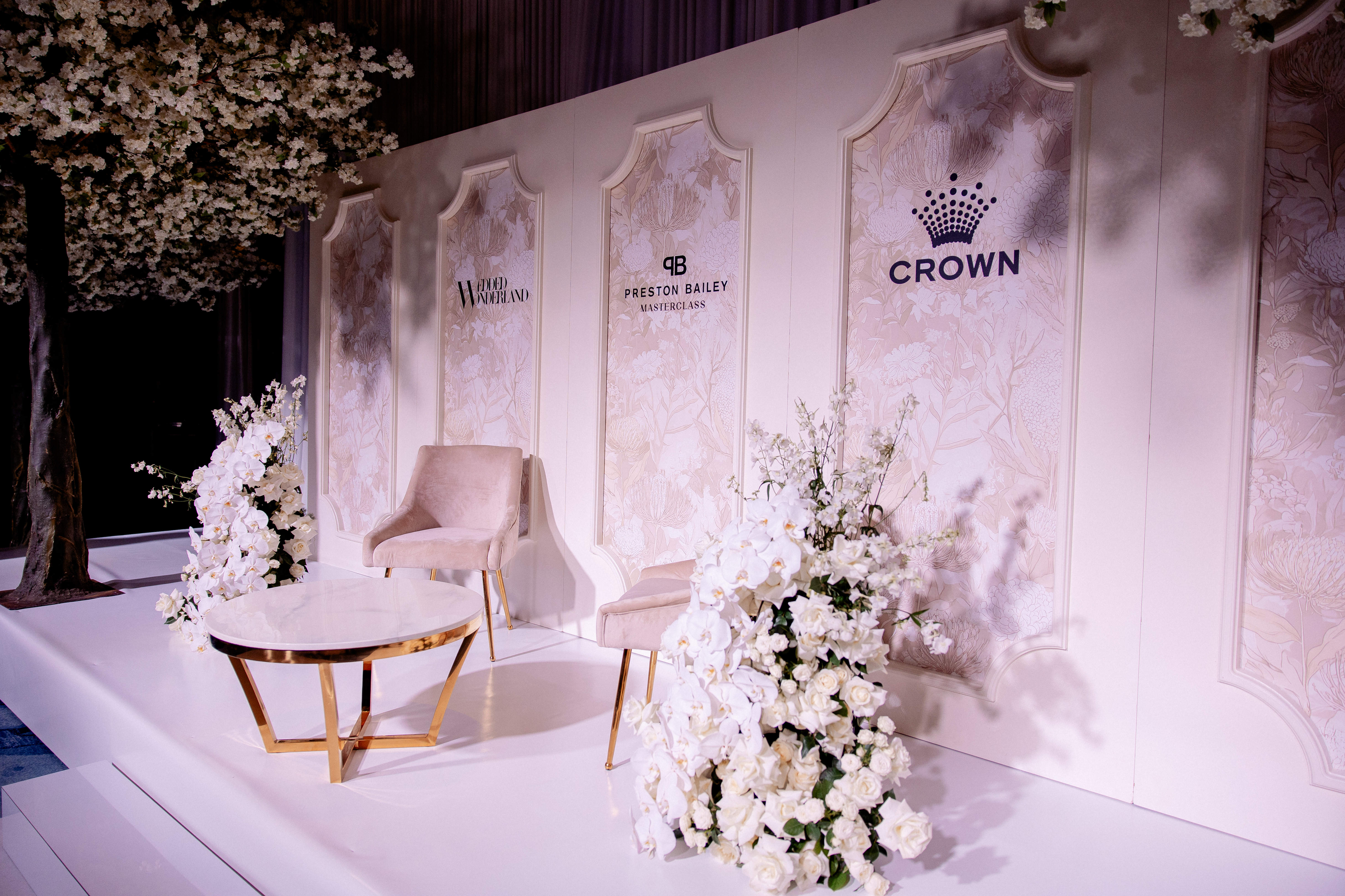 An exquisite floral installation in a styled designer space at Wedded World