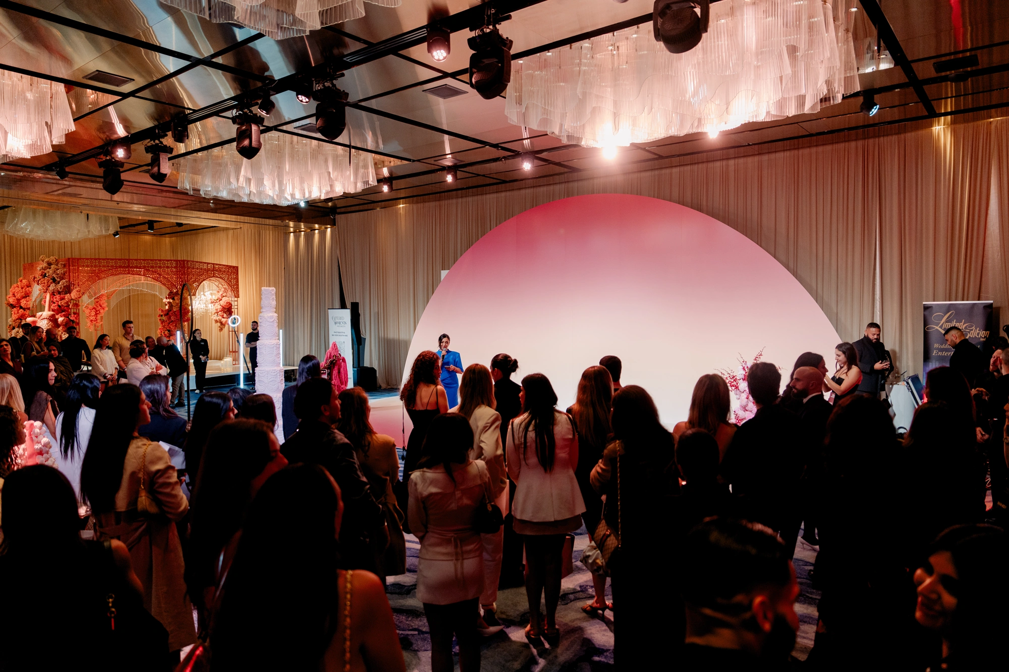Guests gathered around the illuminated main stage at Wedded World