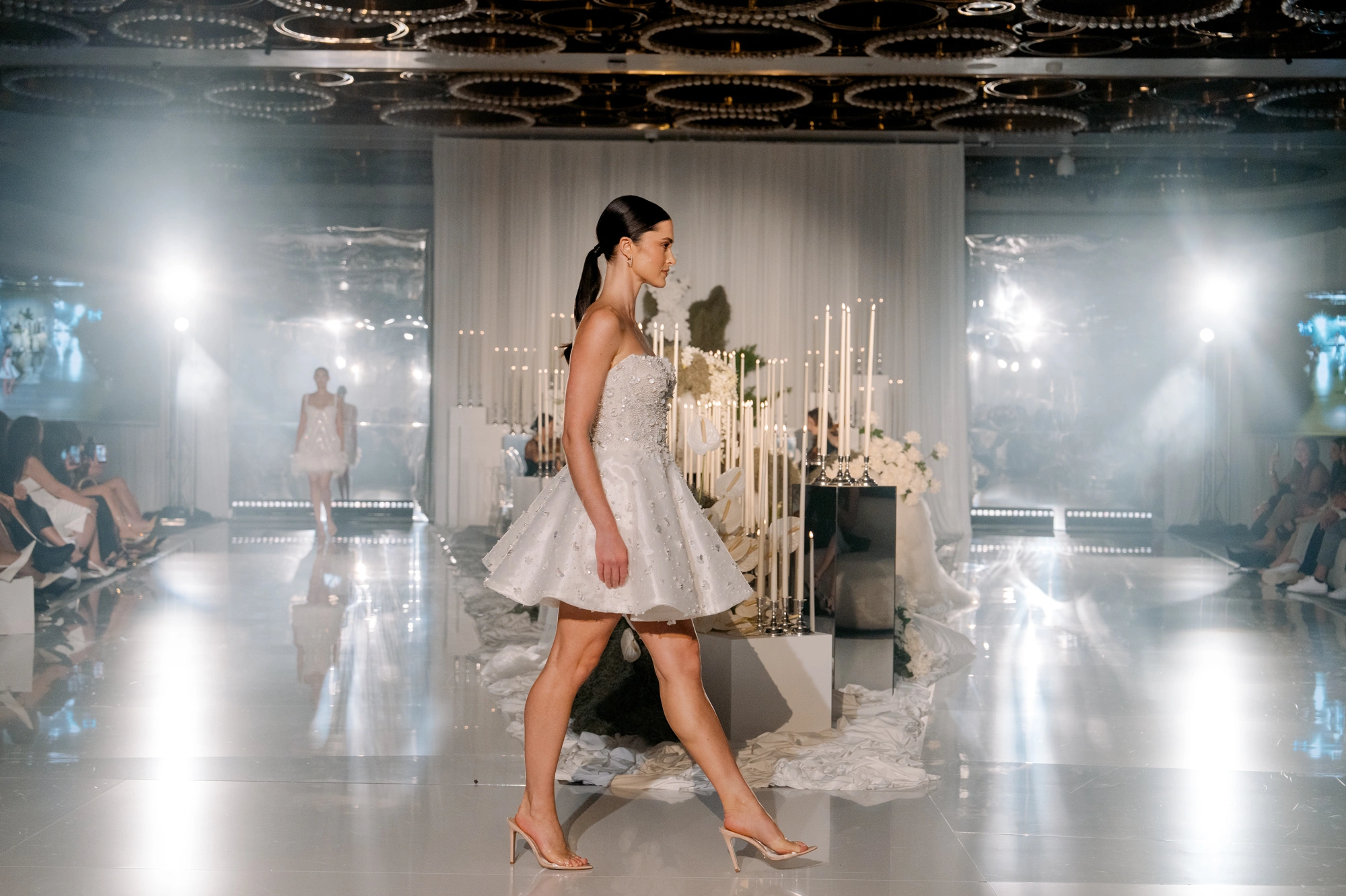 A model presenting bridal couture on the runway at Wedded World